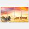 Designart - Cute Zebras Grazing in Grassland - Animal Canvas Art Print